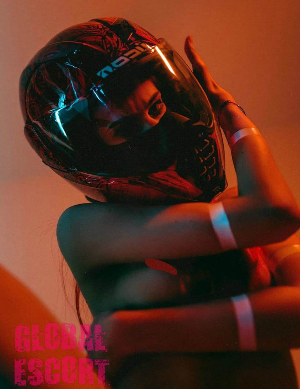 nude sexy escort model Christina at a photo shoot in a helmet