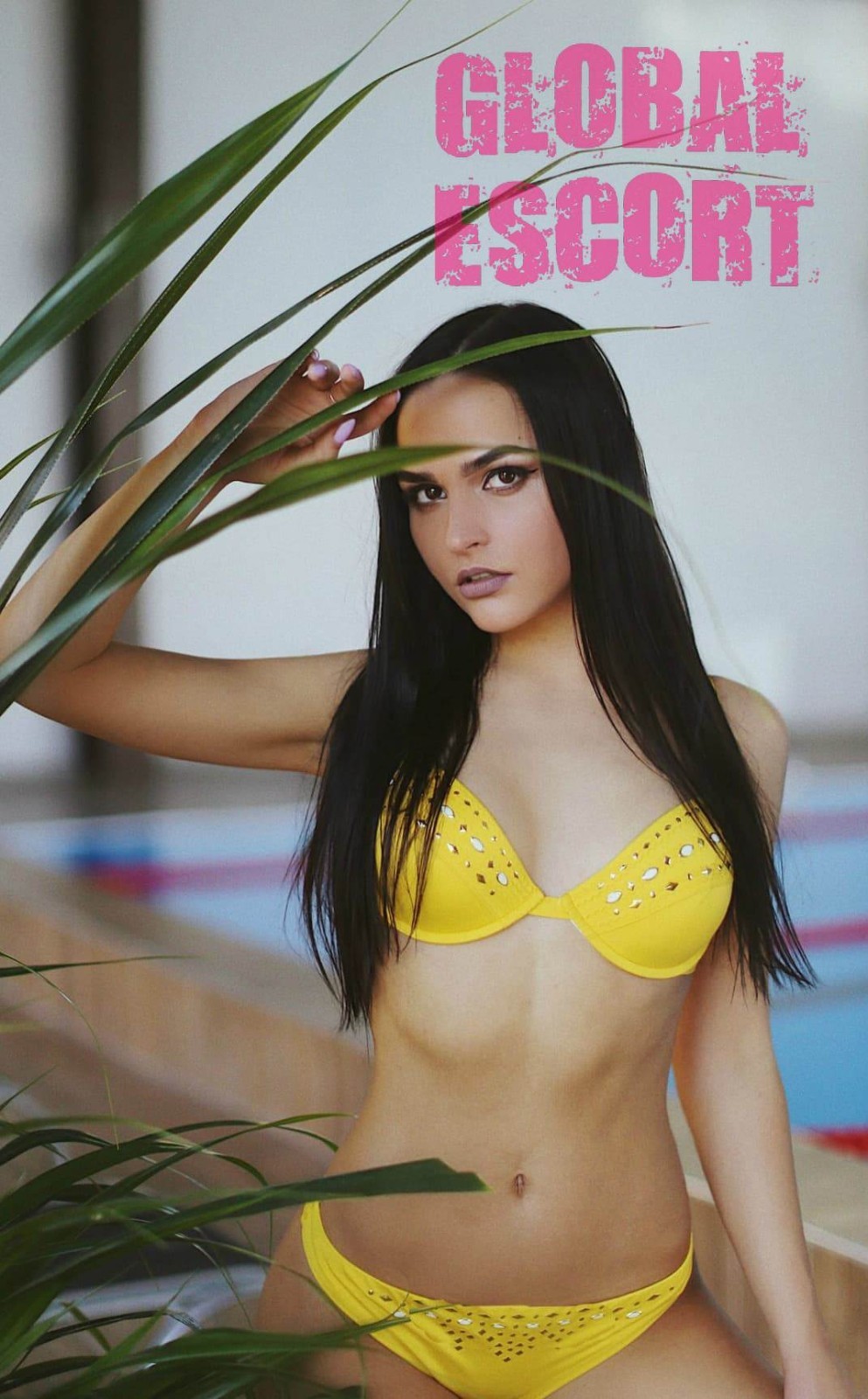 sexy escort model in a yellow swimsuit in the besaine
