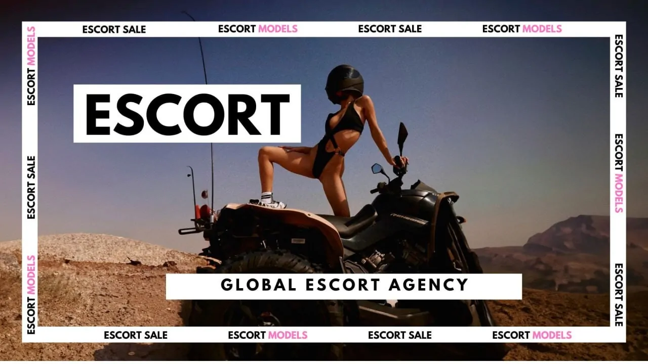 Ukrainian escort Model on a black motorcycle wearing a helmet in the desert.