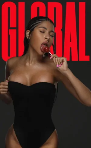 Curvy ebony elite escort model seductively licking lollipop in black bodysuit, providing luxury companion services in Miami and Paris for premium GFE experiences.